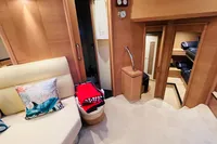 Interior of 2008 Astondoa Open 53 yacht, featuring cozy seating and modern design.
