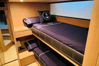 Interior of 2008 Astondoa Open 53 yacht with bunk beds and nautical decor.