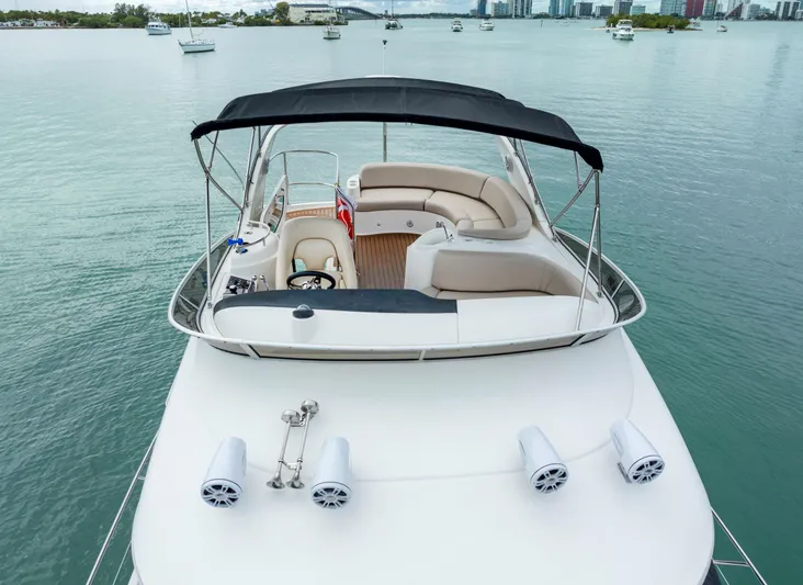 Crescendo Yacht Photos Pics 2012 Meridian Sedan Bridge yacht with spacious upper deck and seating area.