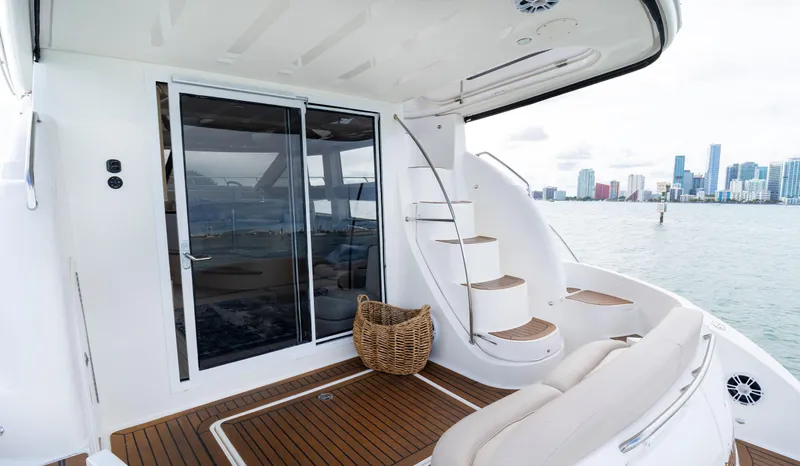 Crescendo Yacht Photos Pics 2012 Meridian Sedan Bridge yacht with city skyline in the background.