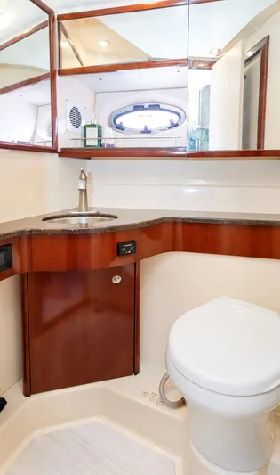 Crescendo Yacht Photos Pics Luxurious bathroom in a 2012 Meridian Sedan Bridge yacht with modern fixtures.