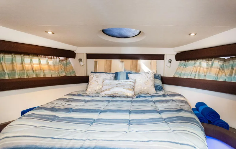 Crescendo Yacht Photos Pics Luxurious bedroom in 2012 Meridian Sedan Bridge yacht with cozy bedding.