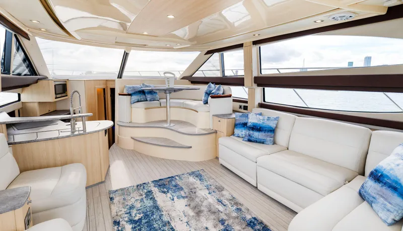 Crescendo Yacht Photos Pics Luxurious interior of a 2012 Meridian Sedan Bridge yacht with modern furnishings.