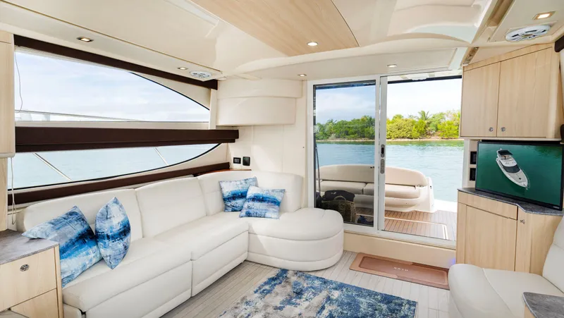 Crescendo Yacht Photos Pics Luxurious interior of a 2012 Meridian Sedan Bridge yacht with waterfront view.