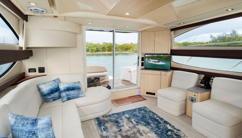 Crescendo Yacht Photos Pics Luxurious interior of a 2012 Meridian Sedan Bridge yacht with modern furnishings.