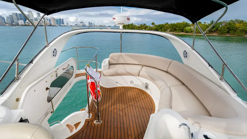 Crescendo Yacht Photos Pics 2012 Meridian Sedan Bridge yacht with spacious deck and scenic water view.