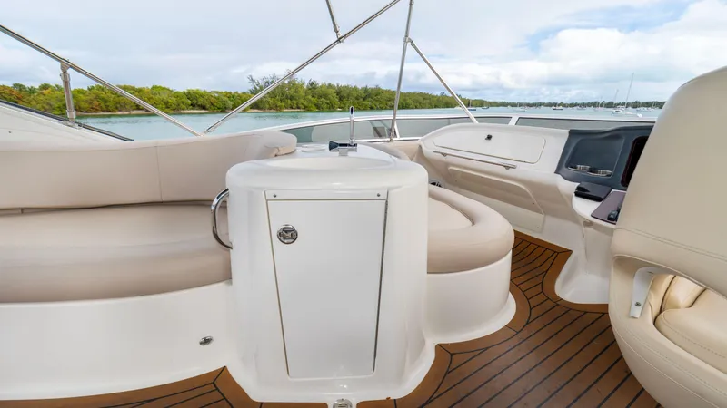 Crescendo Yacht Photos Pics 2012 Meridian Sedan Bridge interior with seating and helm, overlooking water.