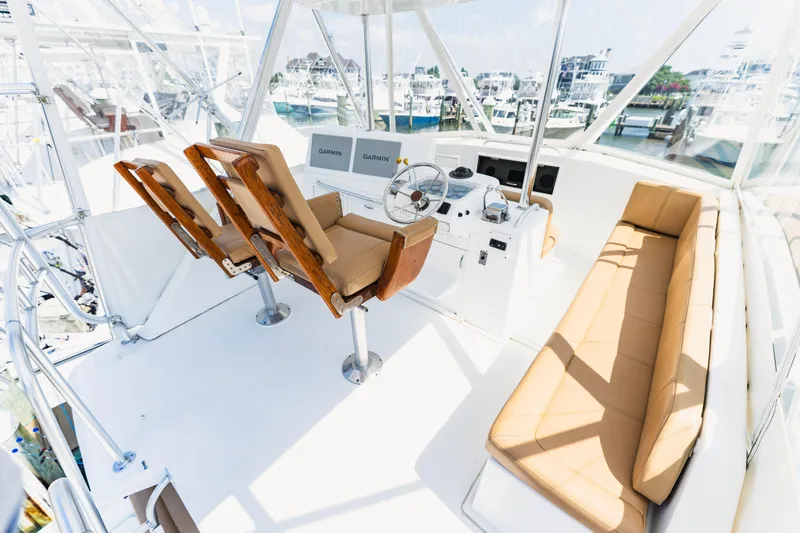  Yacht Photos Pics Interior of 1984 Ocean Yachts 46, featuring helm, seating, and navigation equipment.