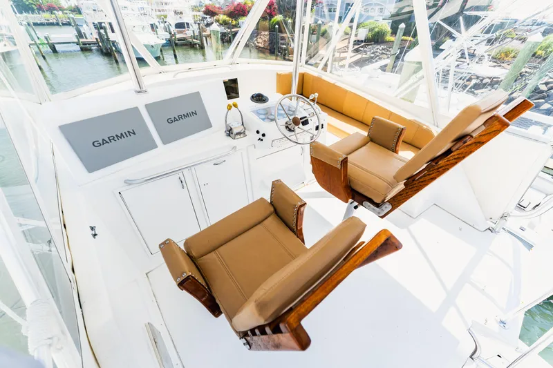  Yacht Photos Pics Cockpit of 1984 Ocean Yachts 46 with Garmin navigation, featuring leather seats and steering wheel.