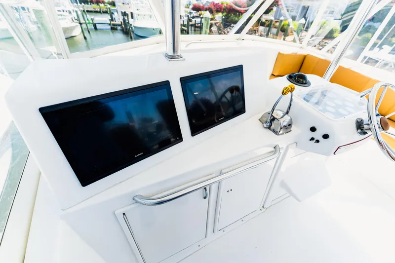  Yacht Photos Pics Cockpit of 1984 Ocean Yachts 46 with dual screens and steering wheel.