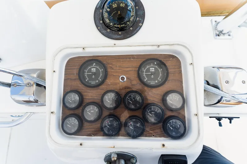  Yacht Photos Pics Control panel of a 1984 Ocean Yachts 46, featuring gauges and compass.