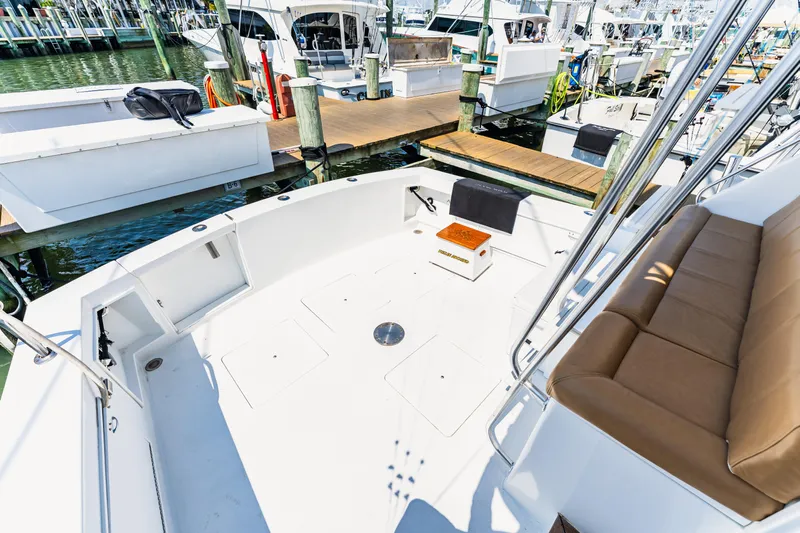  Yacht Photos Pics 1984 Ocean Yachts 46 boat deck with seating, docked at marina.