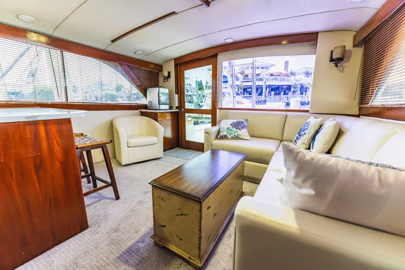  Yacht Photos Pics Luxurious interior of 1984 Ocean Yachts 46, featuring elegant seating and wooden accents.