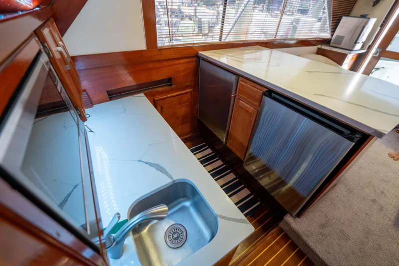  Yacht Photos Pics Interior of 1984 Ocean Yachts 46, featuring modern kitchen with marble countertops and stainless steel appliances.