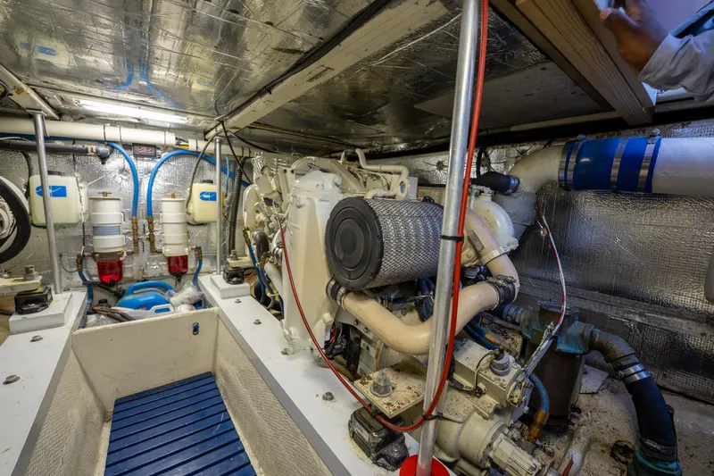  Yacht Photos Pics Engine room of a 1984 Ocean Yachts 46, showcasing mechanical components and insulation.