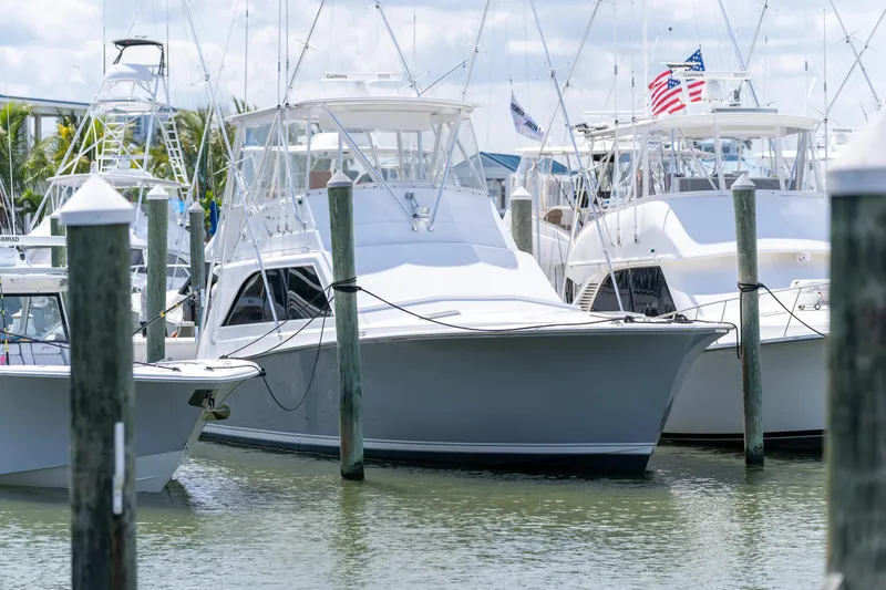  Yacht Photos Pics 1984 Ocean Yachts 46 docked among other boats in a marina.