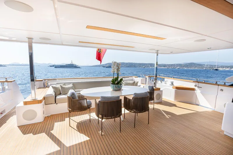 Haiami Yacht Photos Pics Luxurious 2022 Custom Line Navetta 33 yacht deck with elegant seating and ocean view.