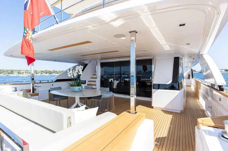 Haiami Yacht Photos Pics Luxurious 2022 Custom Line Navetta 33 yacht deck with elegant seating and ocean view.