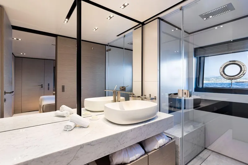 Haiami Yacht Photos Pics Luxurious bathroom on 2022 Custom Line Navetta 33 yacht with modern fixtures and ocean view.