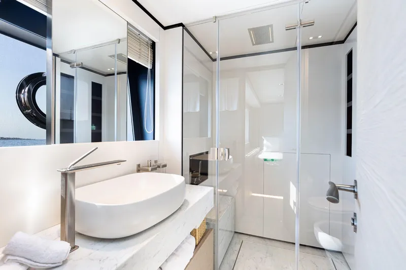 Haiami Yacht Photos Pics Luxurious bathroom on 2022 Custom Line Navetta 33 yacht with modern fixtures and elegant design.
