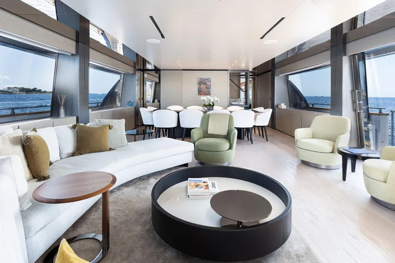 Haiami Yacht Photos Pics Luxurious interior of 2022 Custom Line Navetta 33 yacht with elegant seating and ocean views.