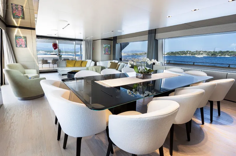 Haiami Yacht Photos Pics Luxurious interior of 2022 Custom Line Navetta 33 yacht with elegant dining area and sea views.
