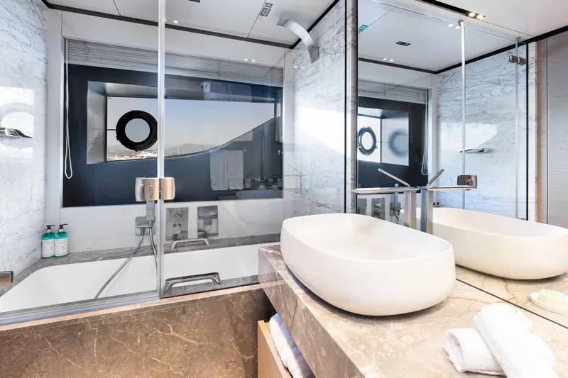 Haiami Yacht Photos Pics Luxurious bathroom on 2022 Custom Line Navetta 33 yacht with modern fixtures and elegant design.