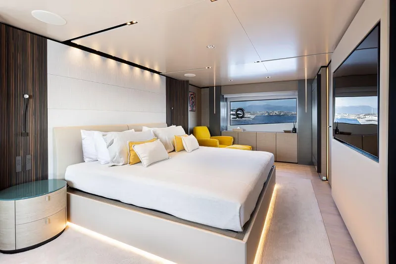 Haiami Yacht Photos Pics Luxurious bedroom interior on 2022 Custom Line Navetta 33 yacht, featuring modern design and ocean view.