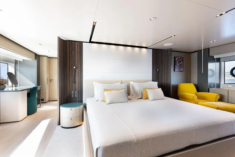 Haiami Yacht Photos Pics Luxurious bedroom interior on 2022 Custom Line Navetta 33 yacht, featuring modern design and elegant furnishings.