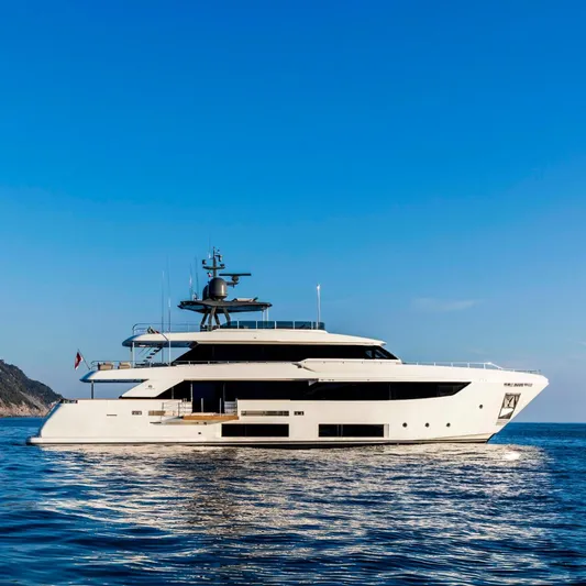 Haiami Yacht Photos Pics Luxury yacht Custom Line Navetta 33, 2022 model, cruising on calm blue waters.