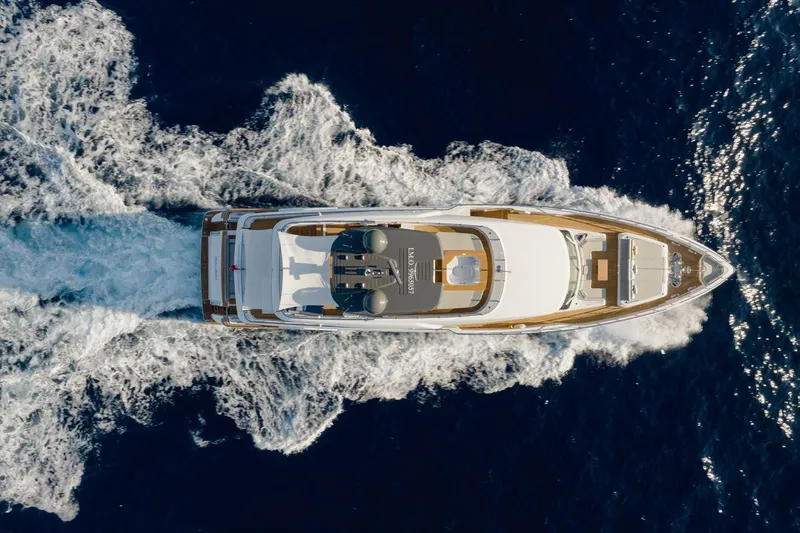 Haiami Yacht Photos Pics Aerial view of 2022 Custom Line Navetta 33 yacht cruising on the ocean.