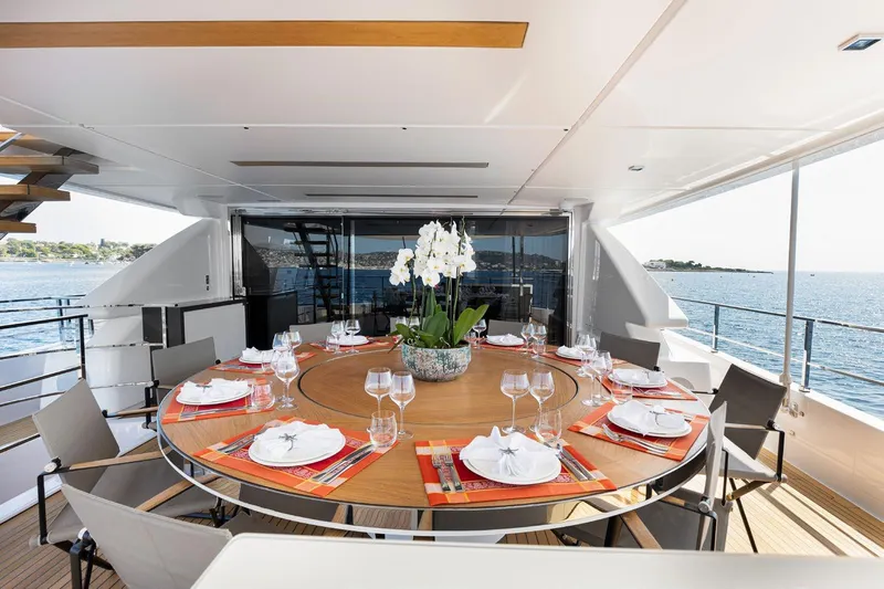 Haiami Yacht Photos Pics Luxurious dining area on 2022 Custom Line Navetta 33 yacht with ocean view.