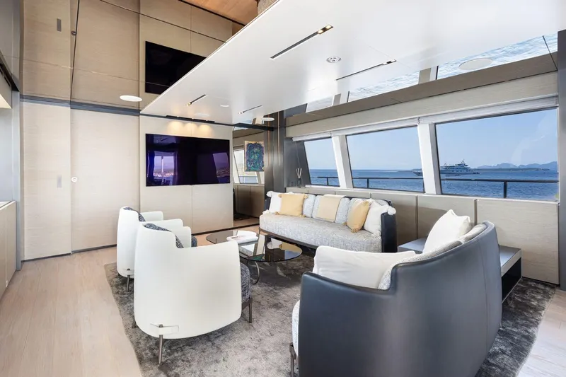 Haiami Yacht Photos Pics Luxurious interior of 2022 Custom Line Navetta 33 yacht with modern seating and ocean view.