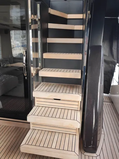  Yacht Photos Pics 2023 Cranchi Sessantasette 67 yacht interior with modern wooden staircase design.