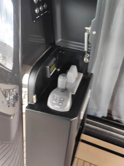  Yacht Photos Pics Control panel of 2023 Cranchi Sessantasette 67 yacht with joystick and buttons.