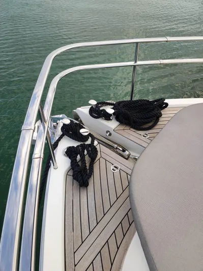  Yacht Photos Pics 2023 Cranchi Sessantasette 67 yacht deck with ropes and railing.