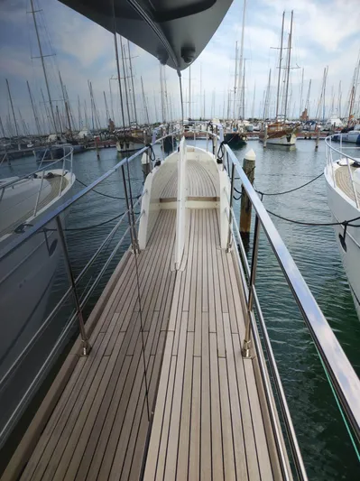  Yacht Photos Pics 2023 Cranchi Sessantasette 67 yacht deck with marina view.