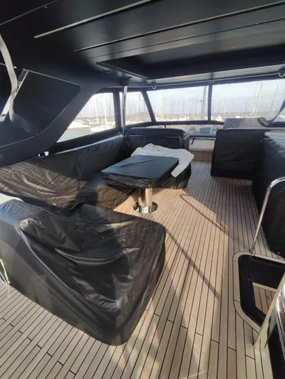  Yacht Photos Pics Luxurious 2023 Cranchi Sessantasette 67 yacht interior with sleek seating and modern design.