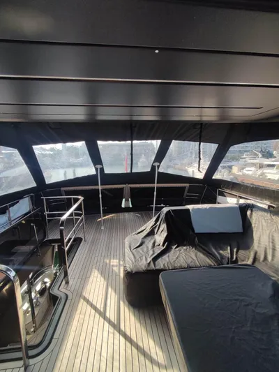  Yacht Photos Pics 2023 Cranchi Sessantasette 67 yacht interior with sleek design and spacious deck area.