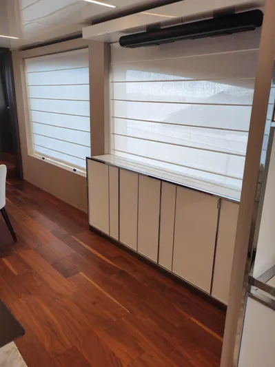  Yacht Photos Pics Interior of 2023 Cranchi Sessantasette 67 yacht with sleek wood flooring and modern cabinetry.