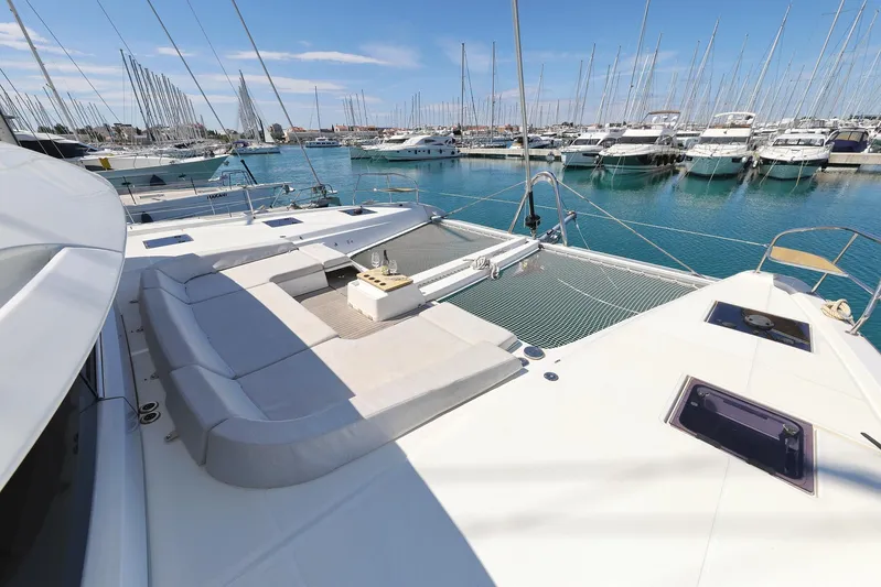 Saliska Yacht Photos Pics 2023 Lagoon 55 yacht with spacious deck and marina view.
