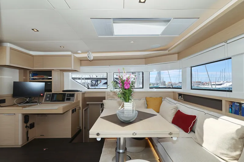 Saliska Yacht Photos Pics Luxurious interior of 2023 Lagoon 55 yacht with modern decor and panoramic windows.