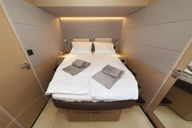 Saliska Yacht Photos Pics Luxurious cabin interior of 2023 Lagoon 55 yacht with twin beds and modern design.