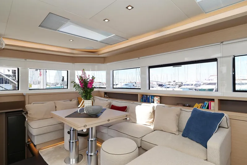 Saliska Yacht Photos Pics Luxurious interior of 2023 Lagoon 55 yacht with elegant seating and modern decor.