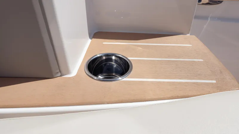  Yacht Photos Pics 2024 Tiara Yachts 48 LE cup holder on sleek wooden deck.