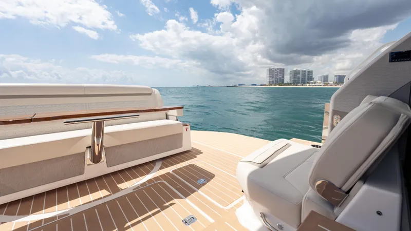  Yacht Photos Pics 2024 Tiara Yachts 48 LE deck with ocean view and modern seating.