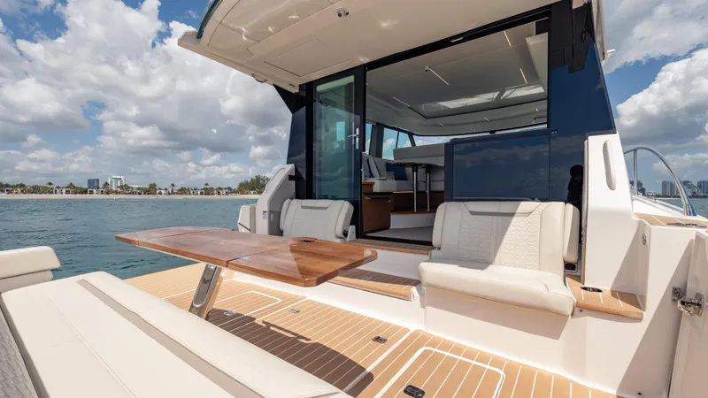  Yacht Photos Pics 2024 Tiara Yachts 48 LE with open deck, luxurious seating, and ocean view.