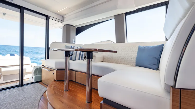  Yacht Photos Pics Luxurious interior of 2024 Tiara Yachts 48 LE with elegant seating and ocean view.
