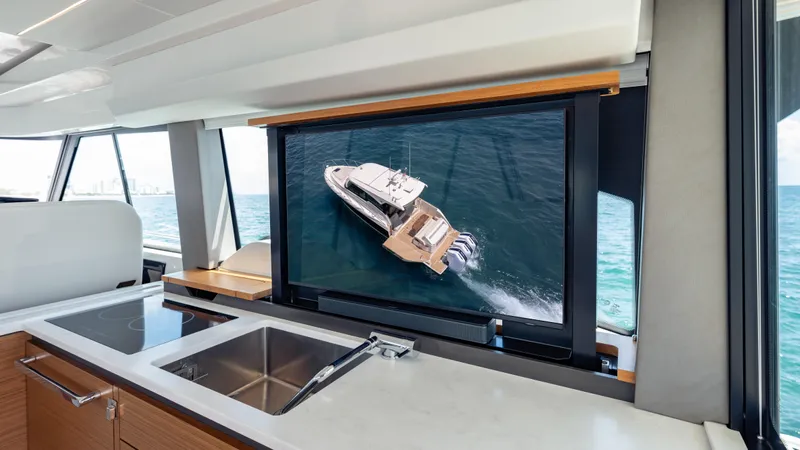  Yacht Photos Pics 2024 Tiara Yachts 48 LE interior with modern kitchen and ocean view.