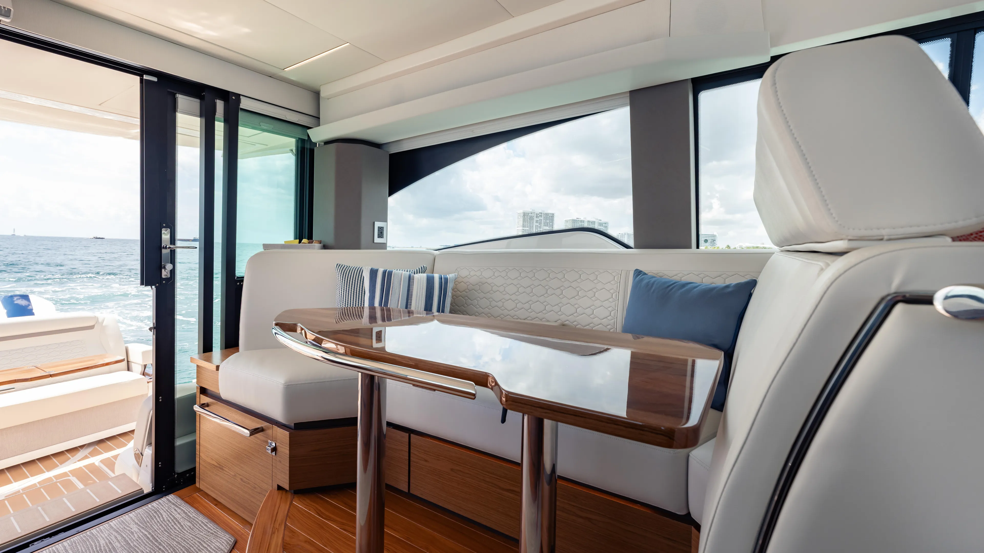  Yacht Photos Pics Luxurious interior of 2024 Tiara Yachts 48 LE with elegant seating and ocean view.